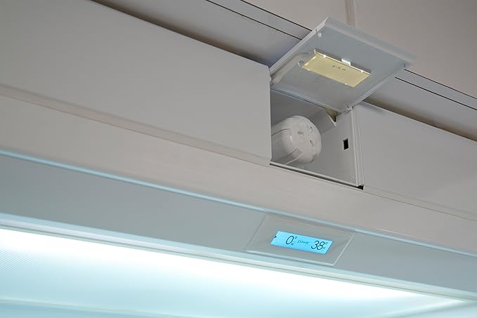 Open upper refrigerator filter compartment showing an installed Sub-Zero water filter