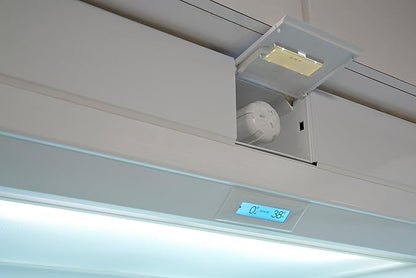 Open upper refrigerator filter compartment showing an installed Sub-Zero water filter